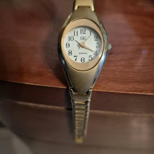 SK women's watch used, gold color