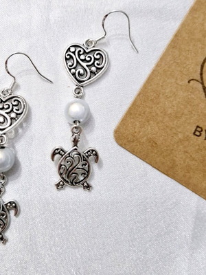 Handmade turtle earrings with silver hooks and glowing beads