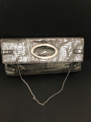 Grey metallic clutch bag used with shoulder chain