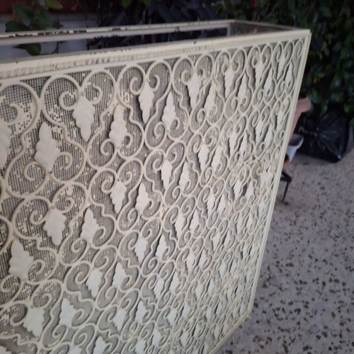 Vintage metal radiator cover with embossed design
