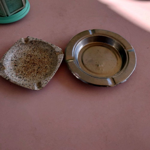 Ashtrays used, one plastic and one metal, set of 2