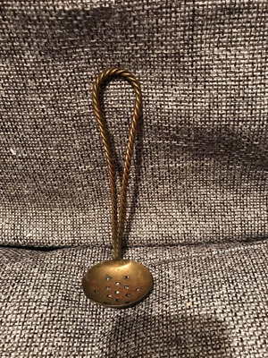 Bronze strainer used with twisted handle vintage