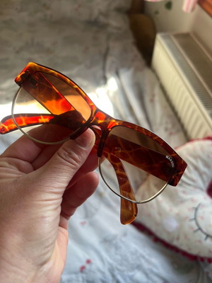 Sunglasses used with animal print plastic frame and brown lens