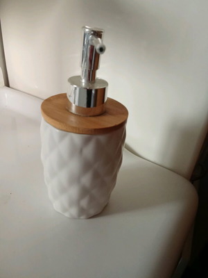 Soap dispenser like new with white ceramic body and bamboo lid