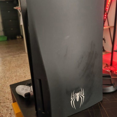 PS5 Spider-Man Edition console with Spider-Man controller