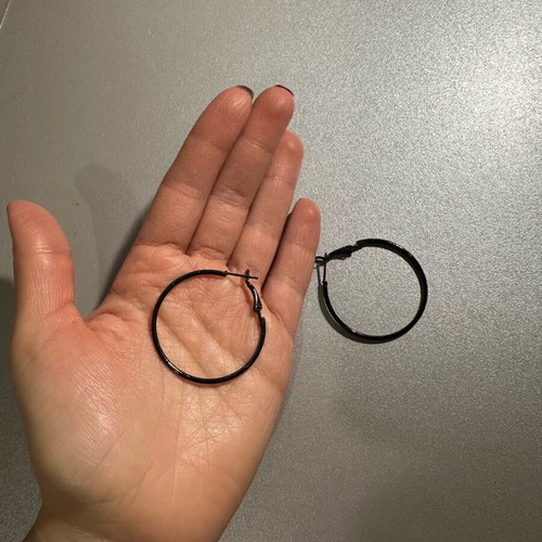 Black hoop earrings used, medium size