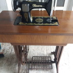 Minerva sewing machine used with table and drawers