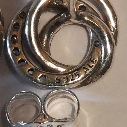 Pandora earrings new with three intertwined circles and cubic zirconia