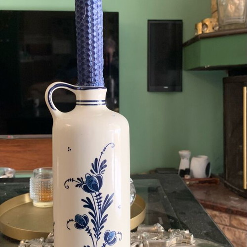 Delft bottle with hand-painted design and candle like new