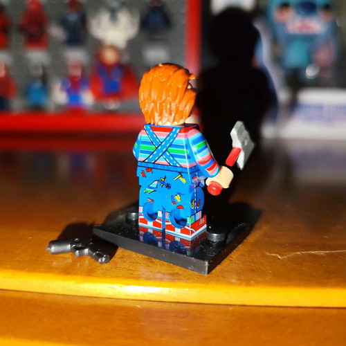 Chucky like new with stand, axe, knife, pistol