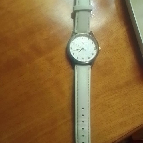 Wristwatch women's new with white strap and quartz mechanism