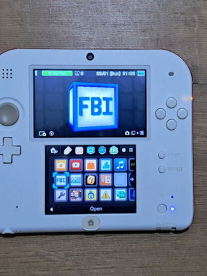 Nintendo 2DS cracked with charger, box and 64GB memory card