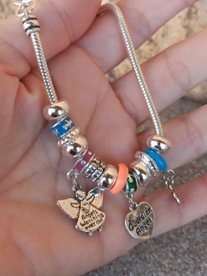 Bracelet decorated with charms and colorful beads new