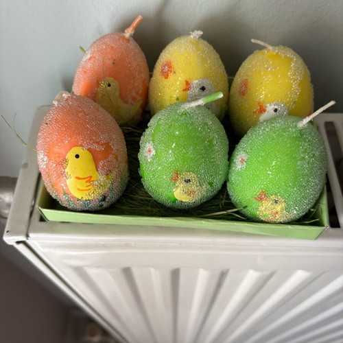 Easter candles shaped like eggs like new, painted