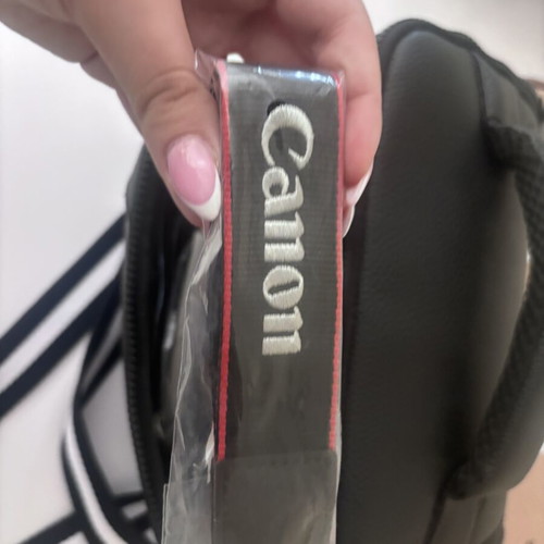 Canon EOS 2000D camera with case and tripod