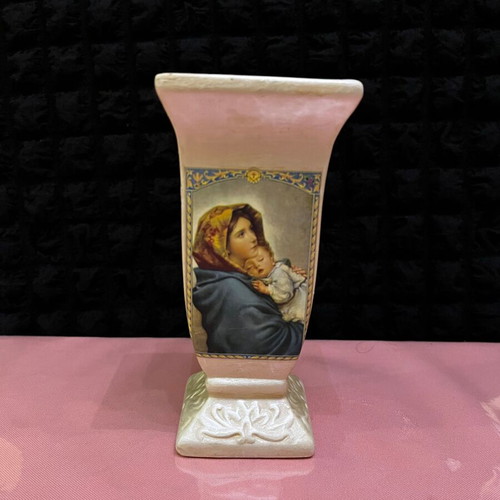 Decorative ceramic candle holder used with Virgin Mary and Christ