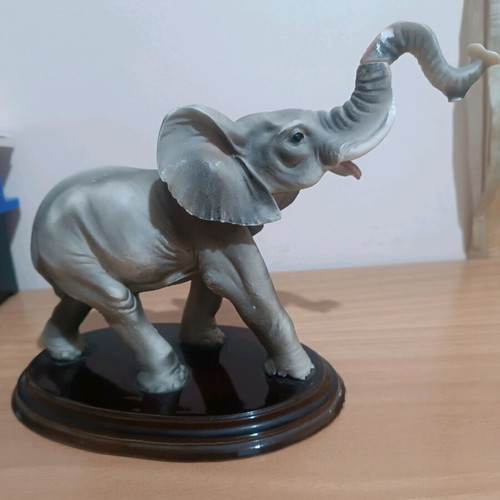 Vintage decorative elephant used with wooden base