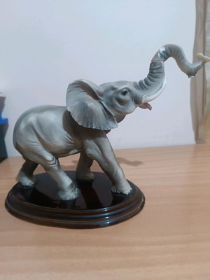 Vintage decorative elephant used with wooden base