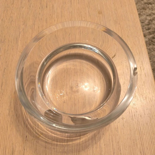 Glass decorative bowl used with silver flower design
