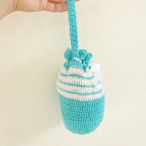 Handmade turquoise knitted pouch toiletry bag used
