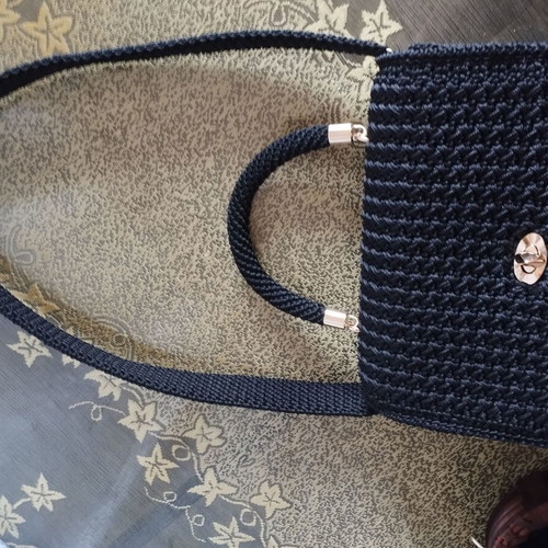 Knitted black handbag with gold accessories, handmade