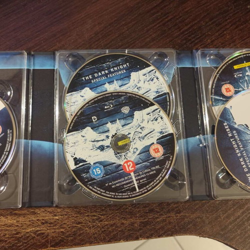 The Dark Knight Trilogy Blu-Ray used with art and making-of book