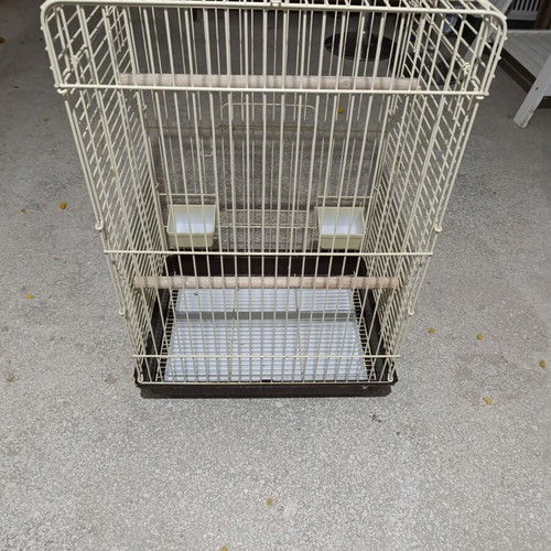Large metal bird cage like new, with wooden perches and feeders