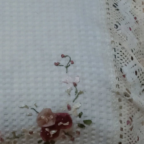 Embroidered tablecloth like new with satin ribbon and floral motifs