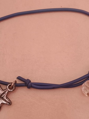 Bracelet with star charm like new, black
