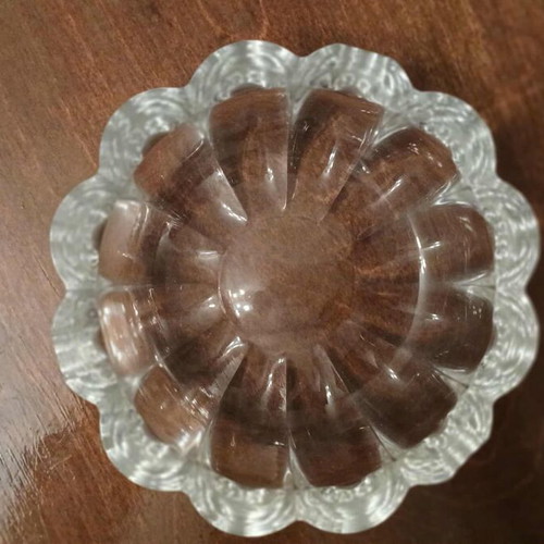 Glass ashtray like new with embossed wavy petal design
