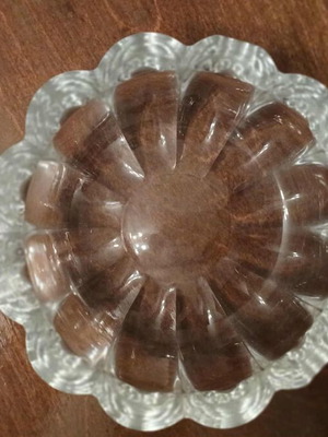 Glass ashtray like new with embossed wavy petal design
