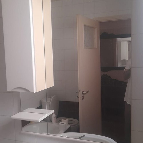Bathroom furniture set used with sink and white mirror