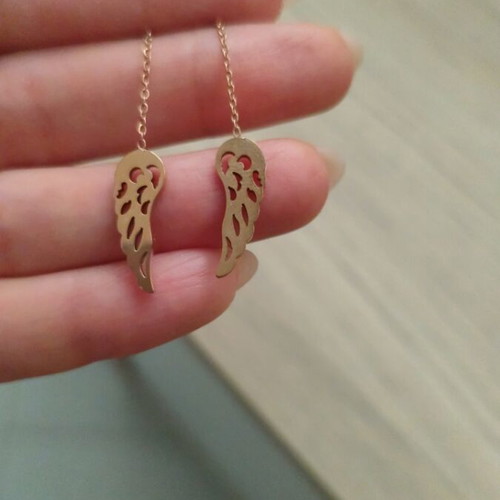 Silver earrings with rose gold wing symbol