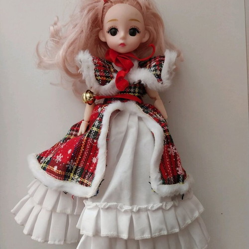 Music doll like new with Christmas outfit and keychain
