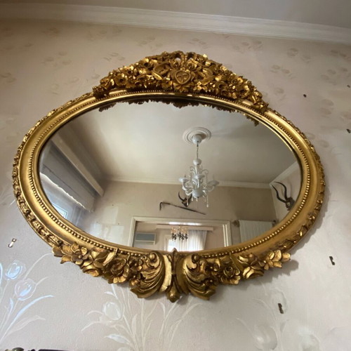 Vintage oval wooden carved mirror used in gold color