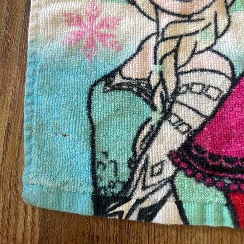 Frozen children's towel 30 x 30 used with small stain