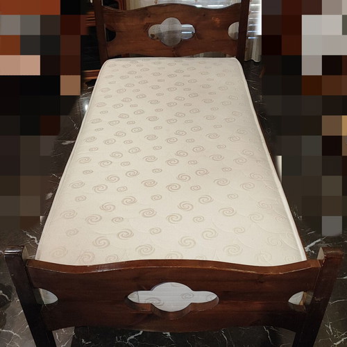Solid wood single bed with clean mattress
