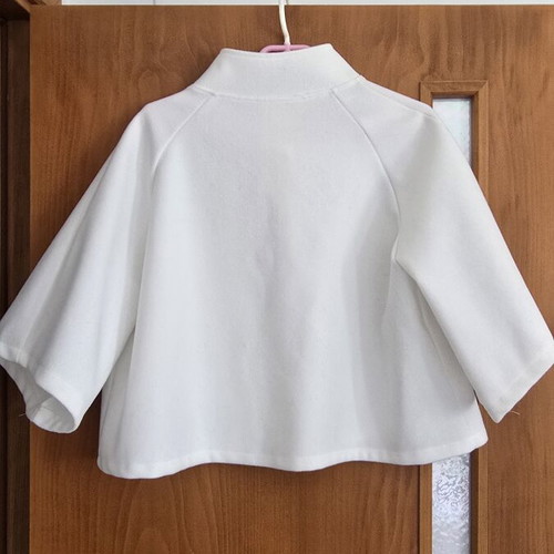 White short jacket with stand-up collar and buttons, minimal style