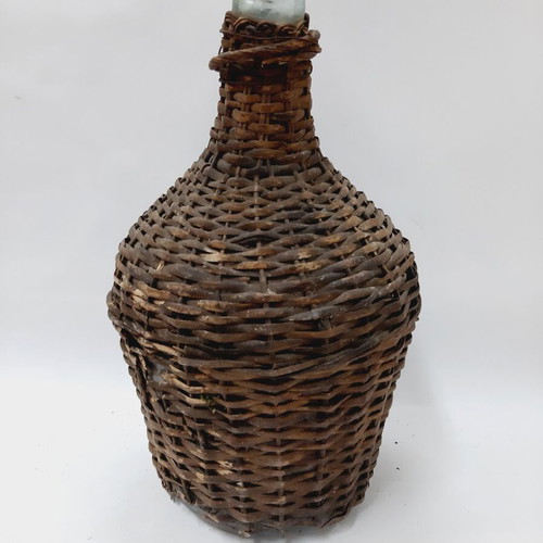 Dame-Jeanne vintage demijohn bottle used, glass with wicker