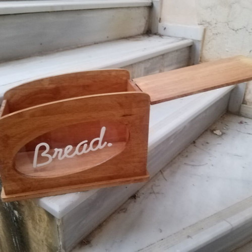 Wooden breadbox with hinged lid and metal handle used