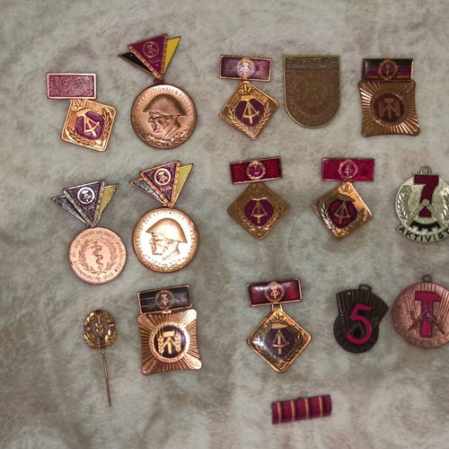 Medals and badges of former East Germany like new, set of 16 pieces