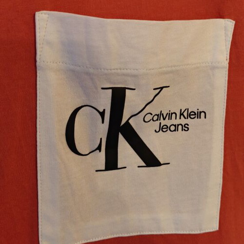 Calvin Klein t-shirt coral with white pocket, like new, size M