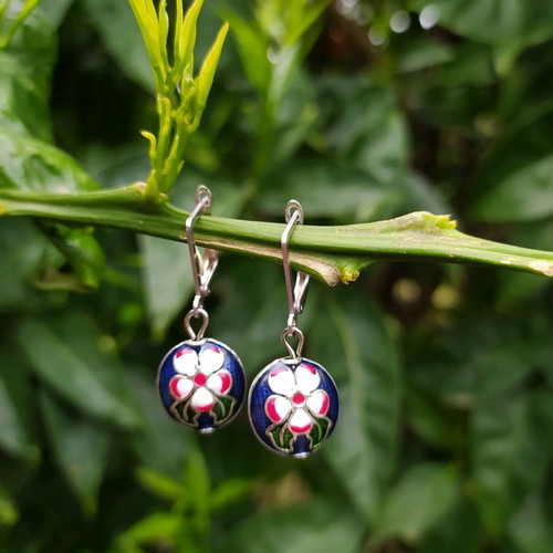Handmade earrings used with metal elements and enamel