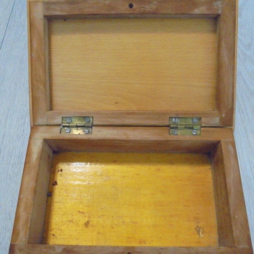 Old wooden carved box with decorative ornaments, used