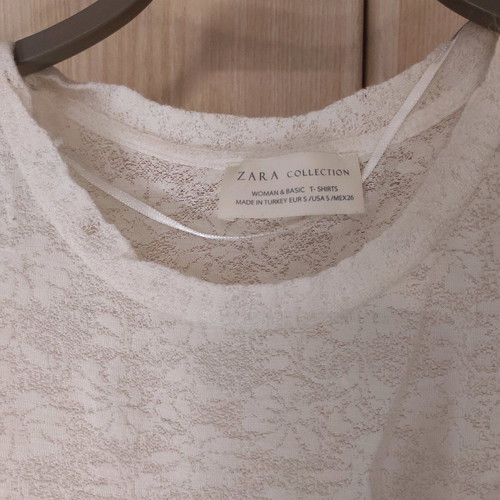 Transparent blouse with large sleeve opening used, size S