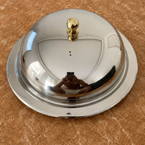 Metal serving bowl with gold handles