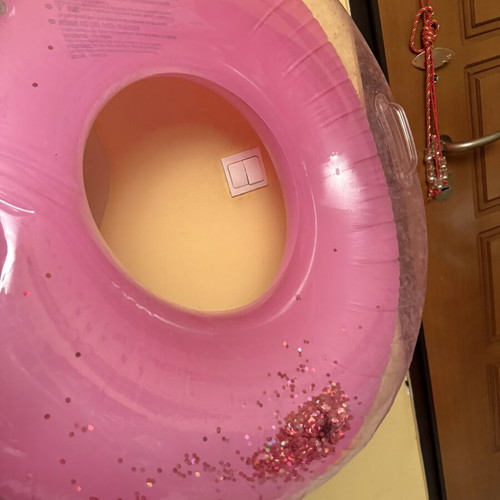 Pink inflatable pool float with glitter