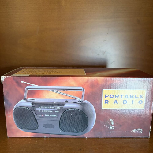 Portable radio with twin speakers