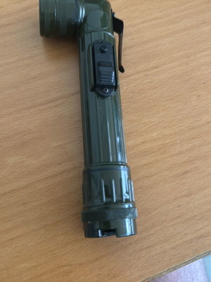 Handheld and pocket flashlight used, with clip and red filter