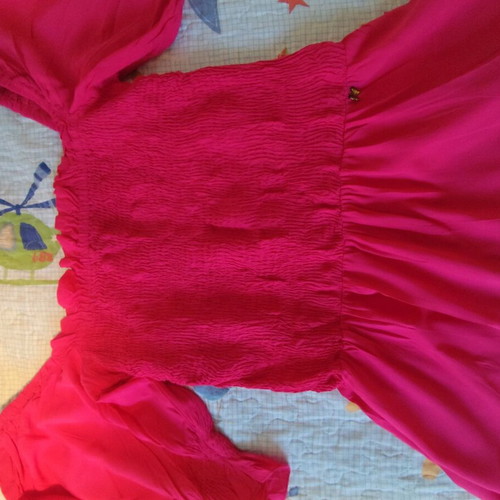 Regalinas fuchsia blouse with smocking like new